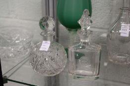 A good Art Deco cut glass scent bottle and stopper and another cut glass scent bottle and stopper.