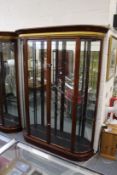 A good large mahogany two door display cabinet with bowed ends.