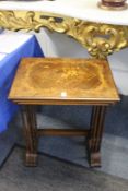 A nest of French inlaid kingwood tables.