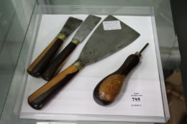 Three old scrapers and a bradawl.