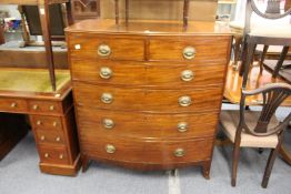 A good 19th century mahogany bow front chest of two short and four graduated long drawers on splay