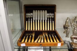 A cased set of fish knives and forks.