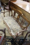 An Edwardian inlaid mahogany salon settee.