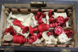 A quantity of ivory and stained ivory chess pieces.
