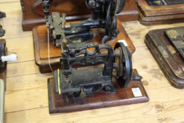 An unusual Raymond's hand cranked chain stitch sewing machine.