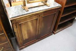 A 19th century mahogany two door side cabinet with later marble top.