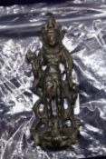 A small cast bronze eastern deity.