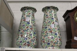 A pair of floral vases.