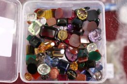 A box of colourful stones.