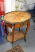 A French inlaid kingwood oval two tier occasional table.
