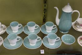 A Susie Cooper Polka Dot part coffee service comprising six cups and saucers, a coffee pot and sugar