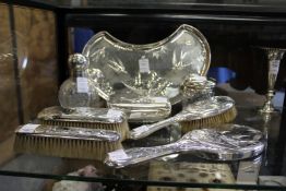 A very good Sheffield silver eight piece dressing table set, comprising crescent shaped tray, cut