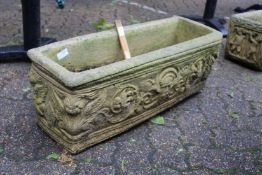 A composite rectangular garden planter.