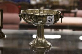 A silver pedestal bowl.