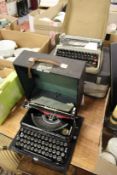 An Imperial Good Companion Model T typewriter, cased, together with an Olivetti typewriter and a