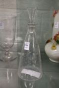 A good conical shaped decanter with star engraved decoration and an engraved armorial.