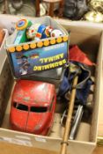 A tin plate truck and other toys.
