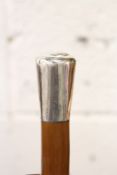 A Malacca walking stick with silver top.