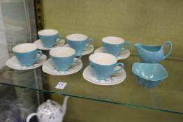 A set of six Midwinter Fashion Shape coffee cups and saucers with matching cream jug and sugar