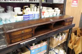 A small wall mounted shelf / chest.