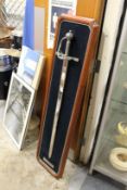 A reproduction of the Sir Francis Drake's sword, mounted on a backing board.