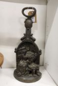 A cast metal figural doorstop.