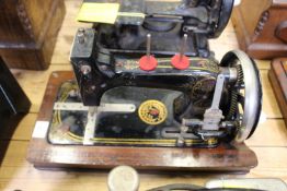 An early hand operated sewing machine.