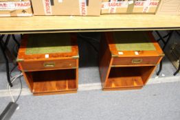 A pair of yew wood brass bound bedside single drawer tables with leather inset tops.