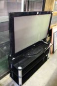 A LG flat screen TV on stand.