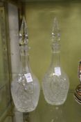 A pair of cut glass decanters.