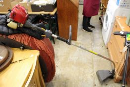 A good Honda 4 stroke petrol strimmer.