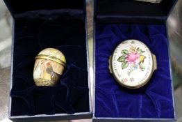 A Halycon Days enamel egg shaped box and an oval box.