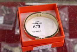 A decorative bangle.