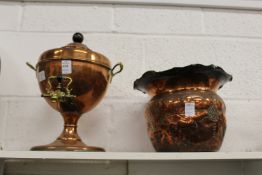 A copper samovar and embossed metal jardiniere.