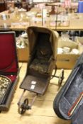 An early miniature pram or invalid carriage.