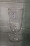 An engraved and cut glass pedestal celery vase.