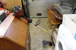 A Lawn King petrol strimmer.