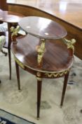 A French style two tier etagere with ormolu mounts.