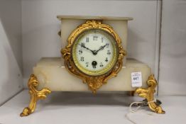 An alabaster mantle clock.