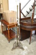 A brass telescopic standard lamp.