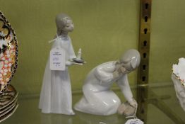 Two small Lladro figures depicting a young girl with a pair of slippers and a young girl holding a
