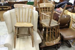 Three stick back kitchen chairs.