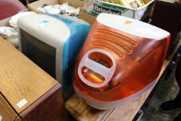 Two colourful Apple mac combination computers and monitors.