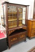 A good Art Nouveau inlaid mahogany standing display cabinet.