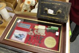 A metal cash box and a Matchbox Models of Yesteryear framed model.