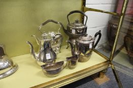 A good plated coffee pot, two kettles on stands and a three piece service.