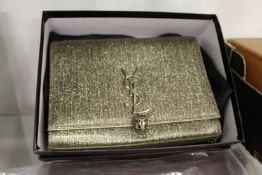 A ladies' silver coloured evening bag.