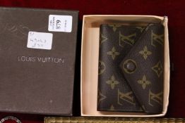 A boxed ladies' purse.