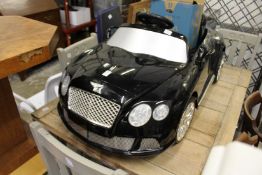 A battery powered Bentley Continental Tourer model car.