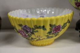 A Chinese yellow ground floral decorated bowl.